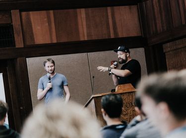 Founders Chris and Matt speak on stage